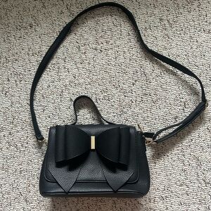 Black faux leather bow cross body bag